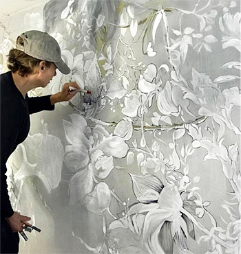 Maria Morga working on mural